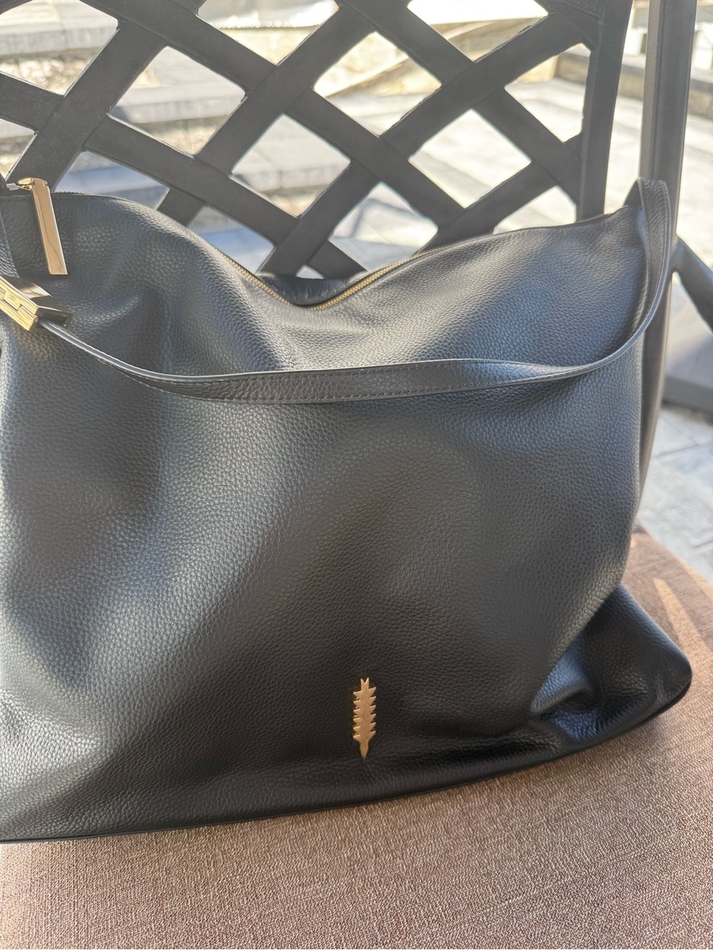 Black Pebbled Leather Shoulder Bag with Gold Accent